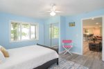 Lower level queen bedroom has partial lake views